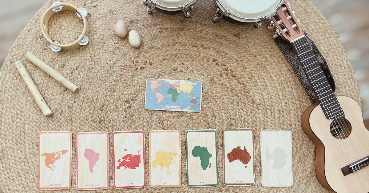 Montessori colour-coded continent song cards and music materials prepared for an early learning session